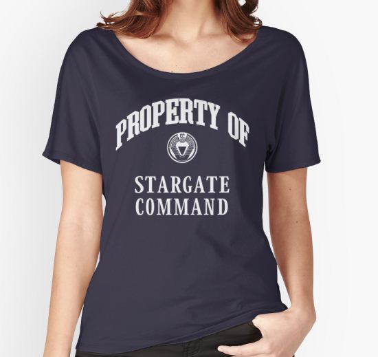 ‘Property of Stargate Command Athletic Wear White ink’ Women's Relaxed Fit T-Shirt by RocketmanTees T-Shirt